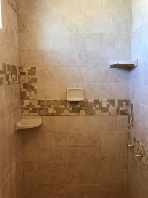 Expertly tiled Oregon bathroom with earthy and natural colors