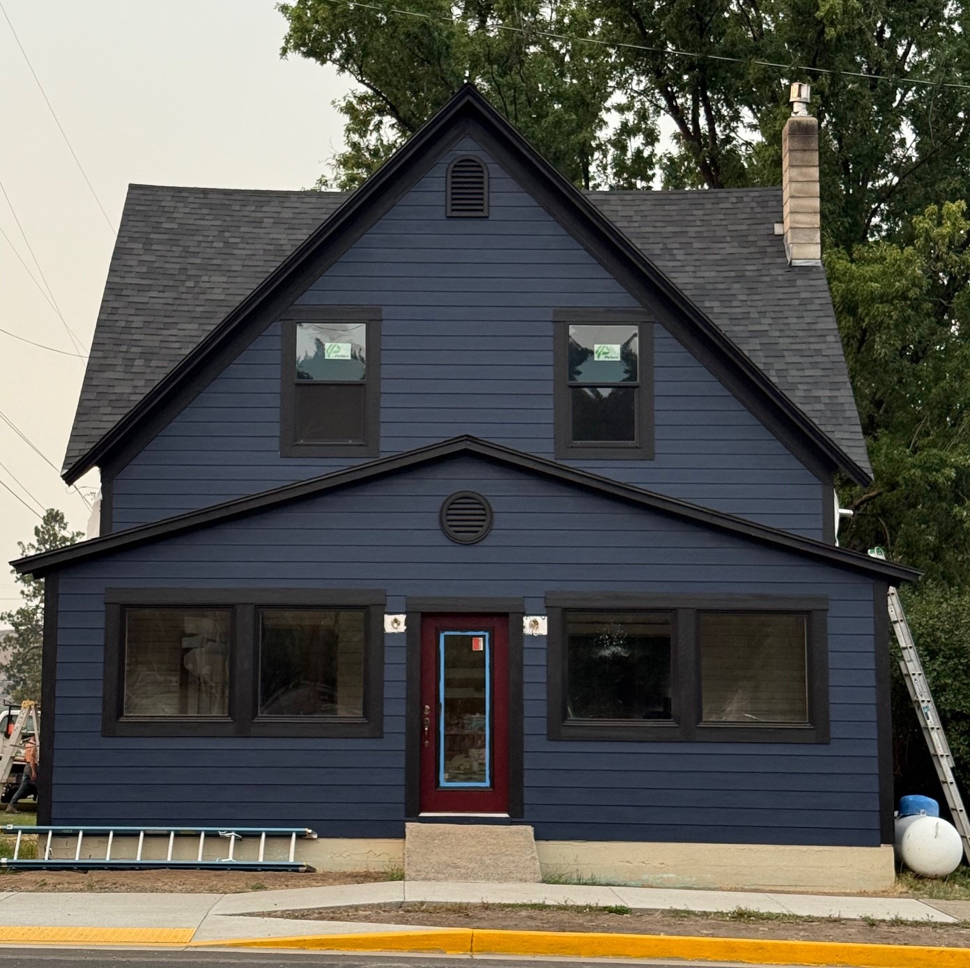 Oregon home after exterior renovation with new siding, modern paint job, new windows, and complete outside remodel.